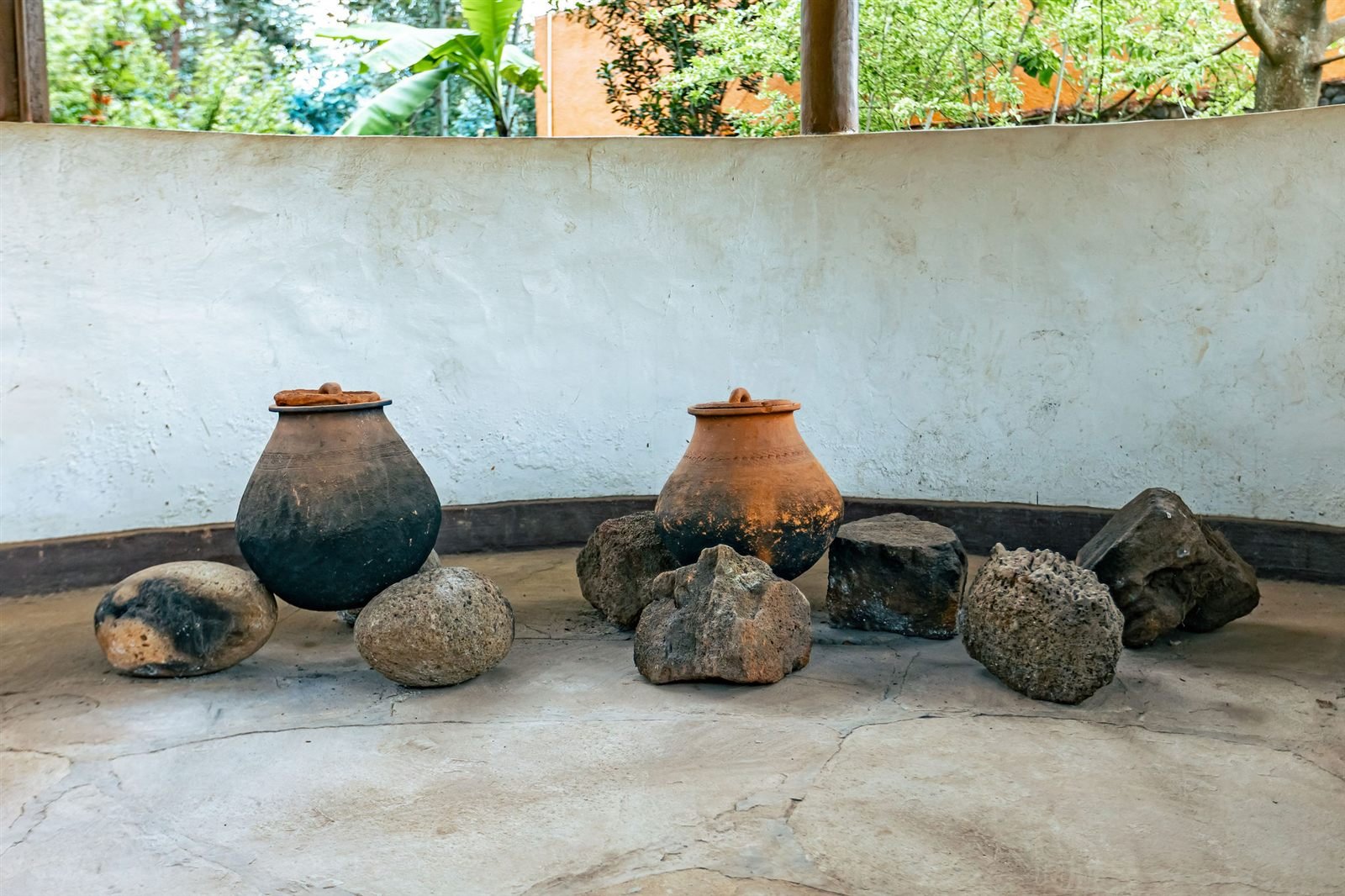 Stone seats around a fire pit in the resort garden